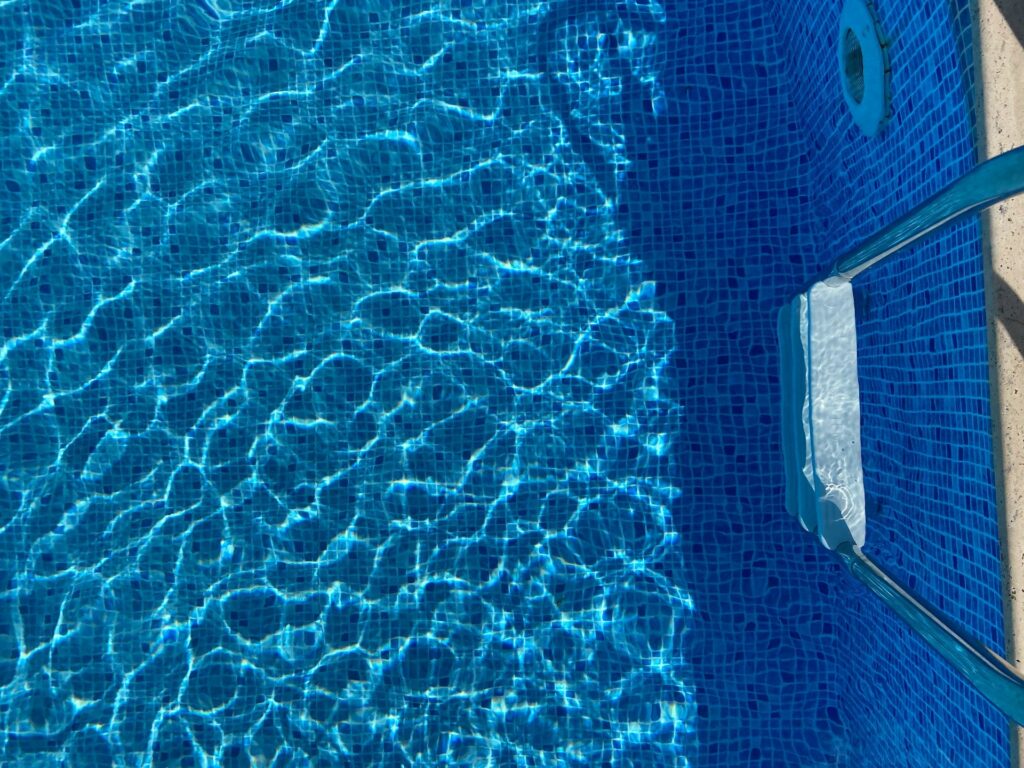 blue and white textile on blue textile
